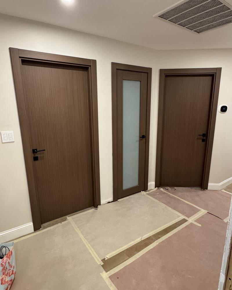Three walnut interior doors, one with frosted glass
